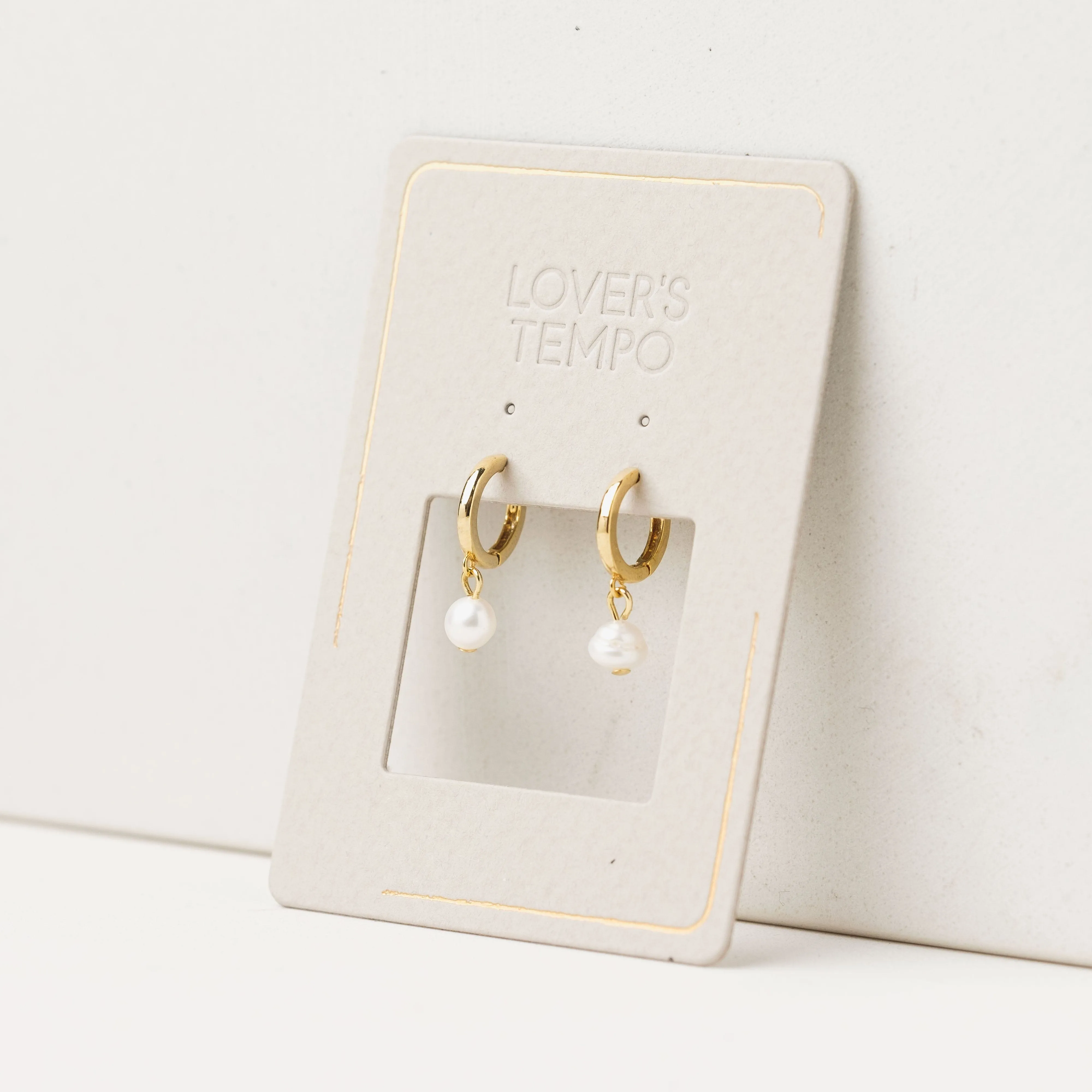 Amari Pearl Huggie Hoop Earrings